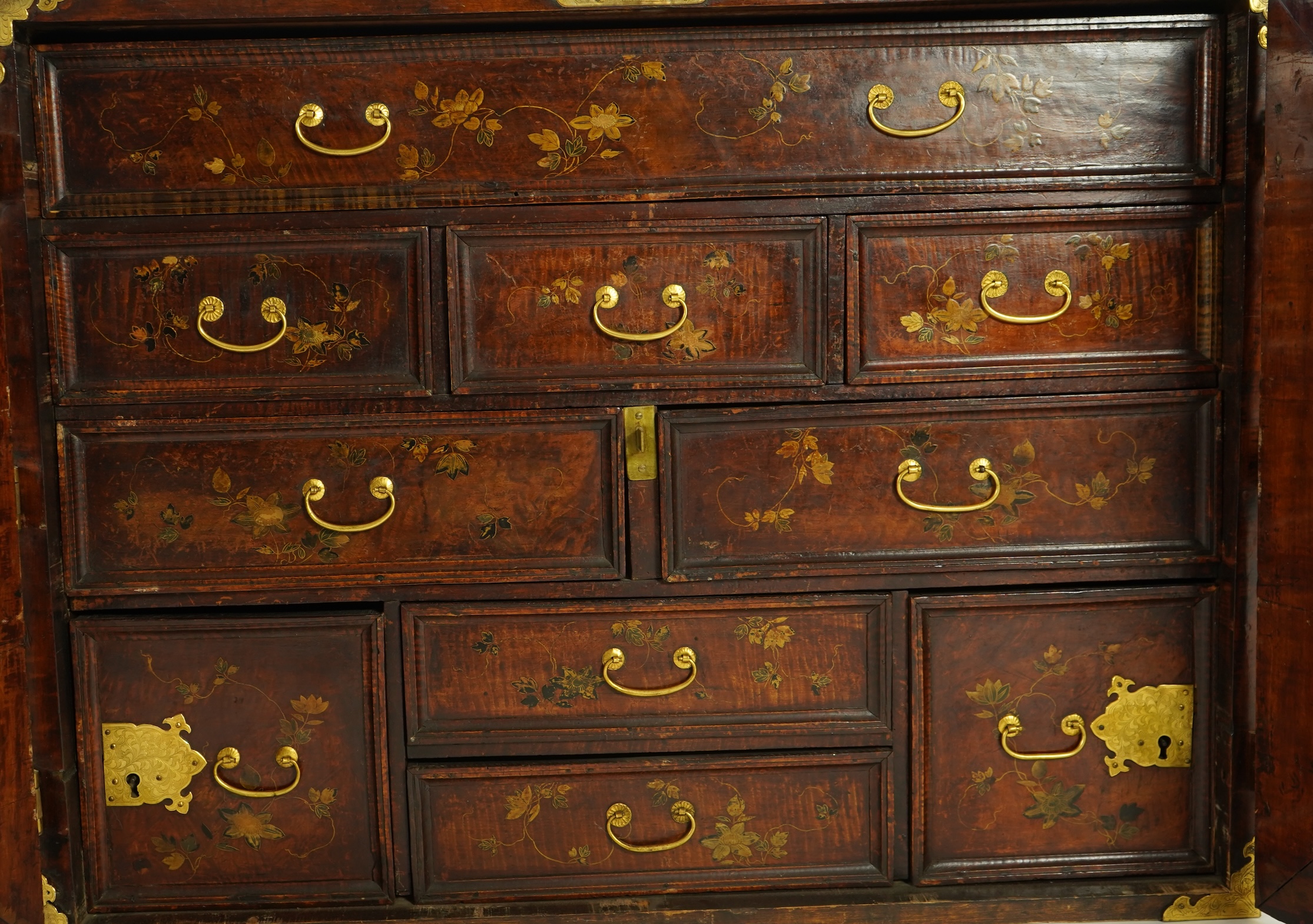 A Japanese mulberry wood, hiromaki-e lacquer and gilt copper mounted cabinet, c.1680-1700